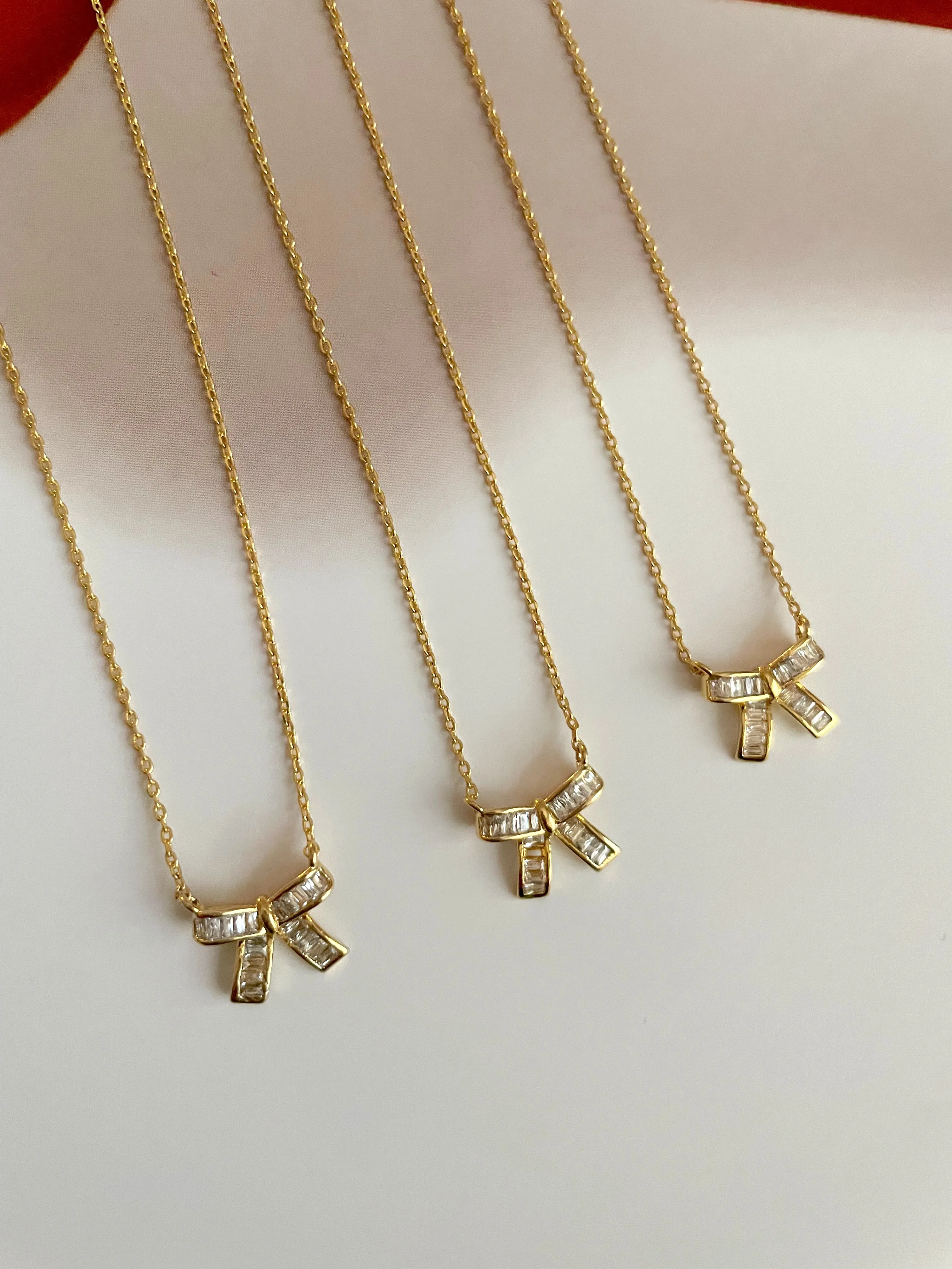 Mini baguette bow necklace